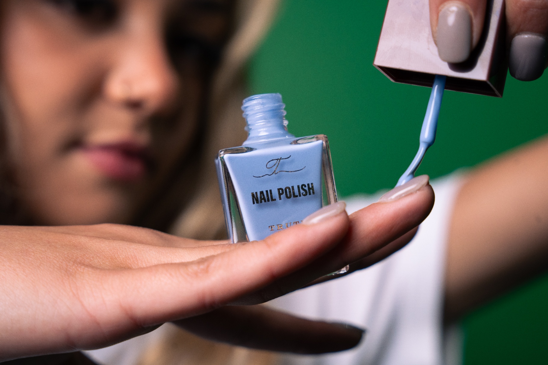 Truth nail polish being applied